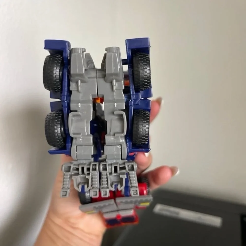 Hasbro Transforming Robot - Red, Blue, and Silver